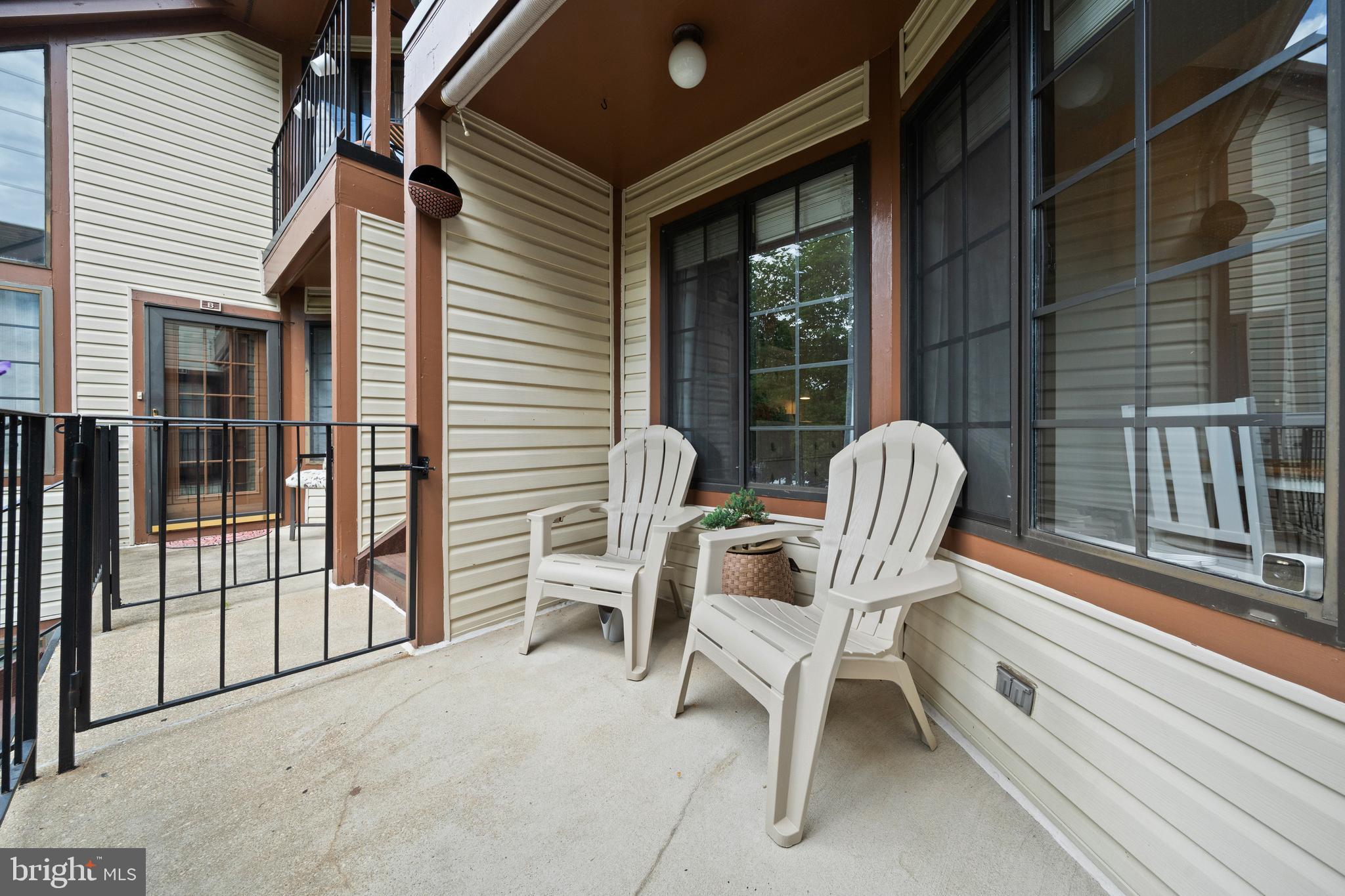 6022 Curtier Drive, Unit E Alexandria, VA 22310 - Photo 30 of 38 a view of a two chairs and table in the balcony
