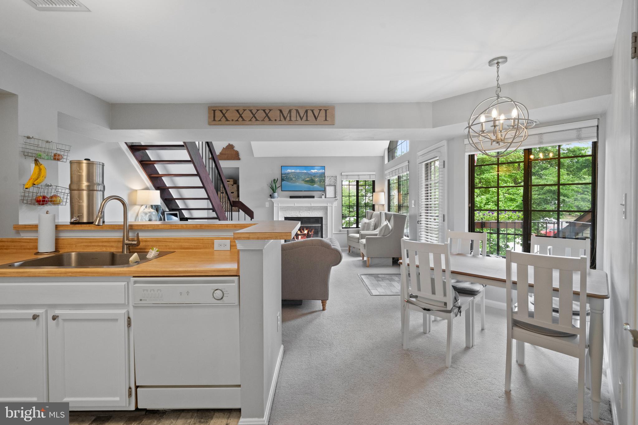 6022 Curtier Drive, Unit E Alexandria, VA 22310 - Photo 3 of 38 a very nice looking dining room with furniture and a chandelier