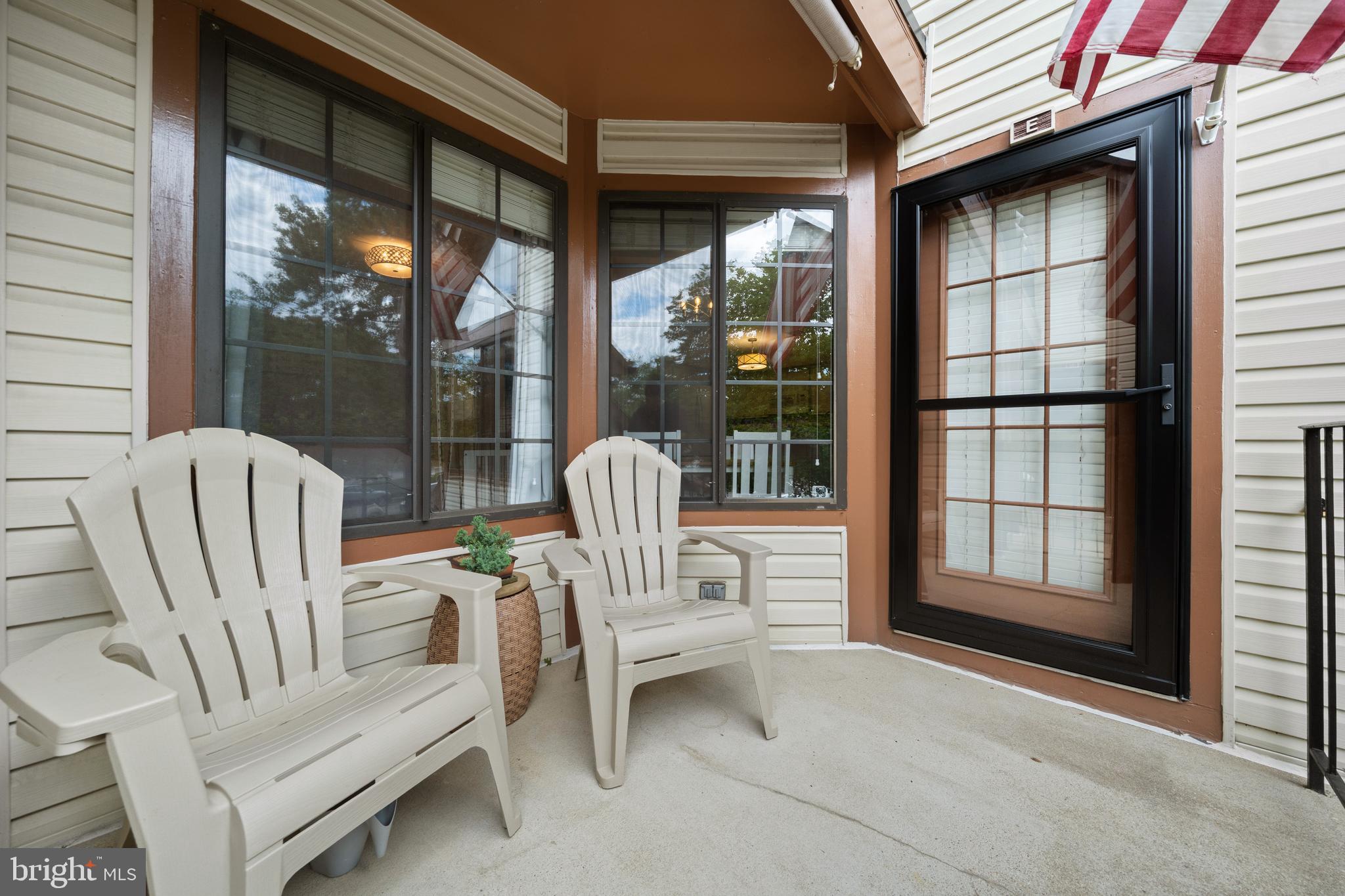 6022 Curtier Drive, Unit E Alexandria, VA 22310 - Photo 31 of 38 a view of porch with furniture and a window
