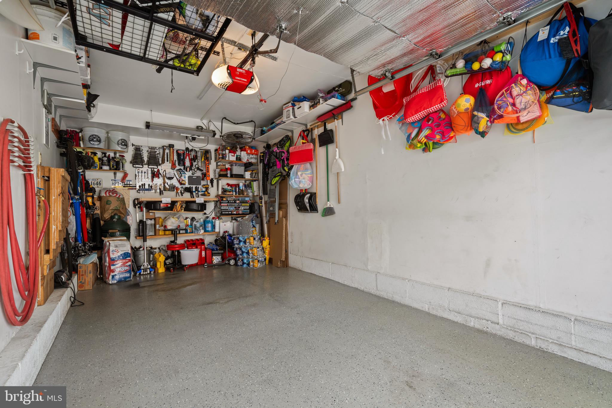 6022 Curtier Drive, Unit E Alexandria, VA 22310 - Photo 36 of 38 a view of a garage with a lot of stuff