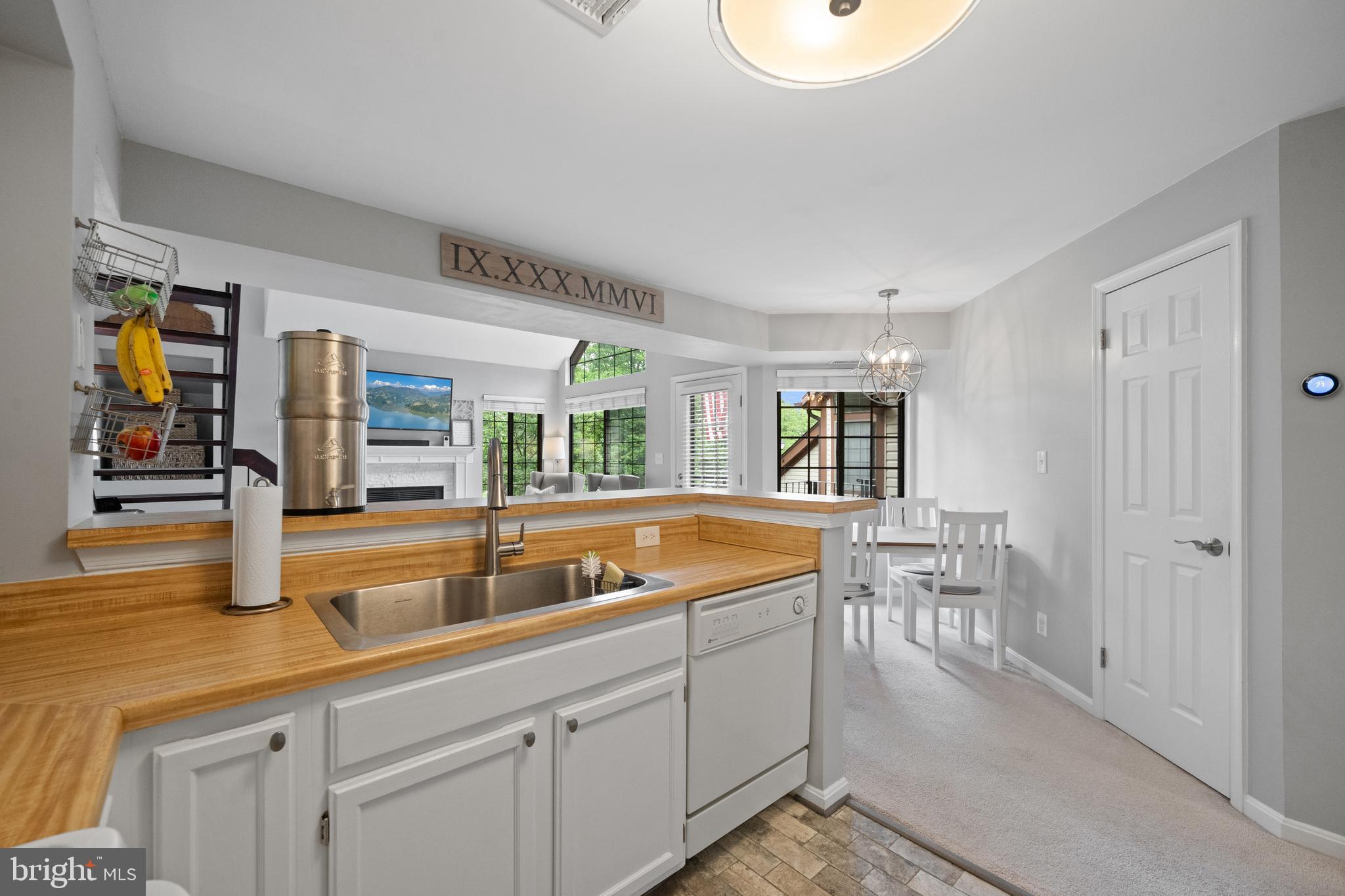 6022 Curtier Drive, Unit E Alexandria, VA 22310 - Photo 8 of 38 a living room with furniture and a window