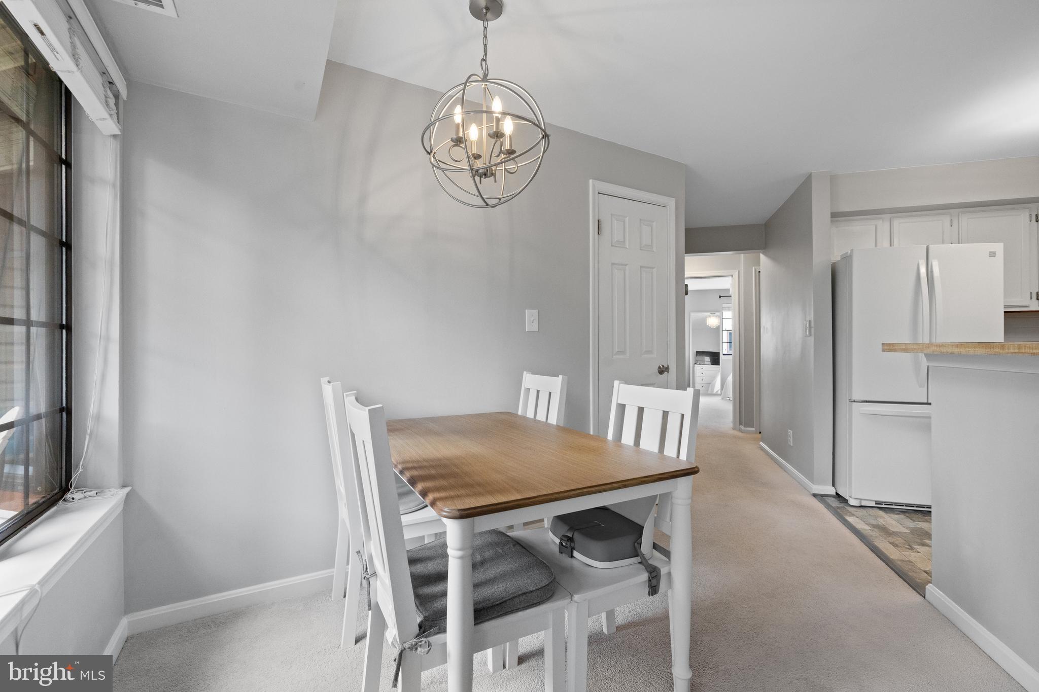 6022 Curtier Drive, Unit E Alexandria, VA 22310 - Photo 9 of 38 a view of a dining room with furniture and wooden floor