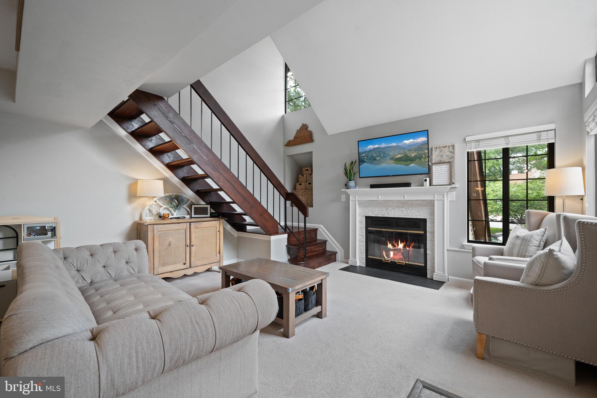 6022 Curtier Drive, Unit E Alexandria, VA 22310 - Photo 10 of 38 a living room with furniture fireplace and flat screen tv