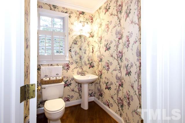 3710 Old Lassiter Mill Road Raleigh, NC 27609 - Photo 14 of 25 a bathroom with a sink toilet and a shower