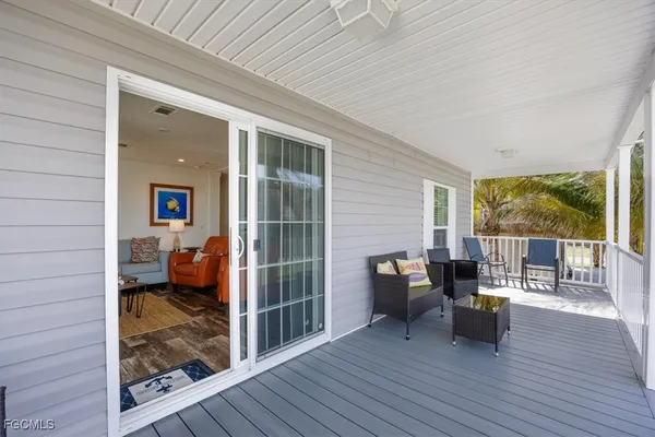 a view of living room and wooden floor