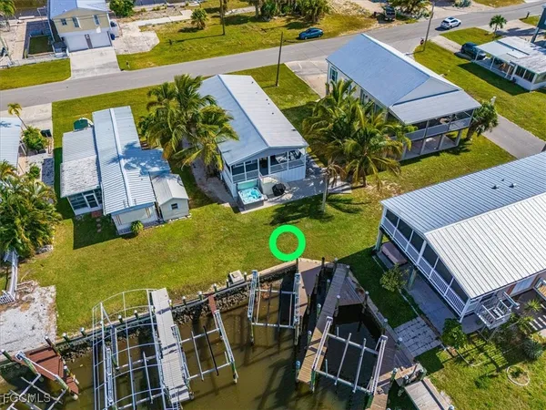 an aerial view of multiple houses with yard