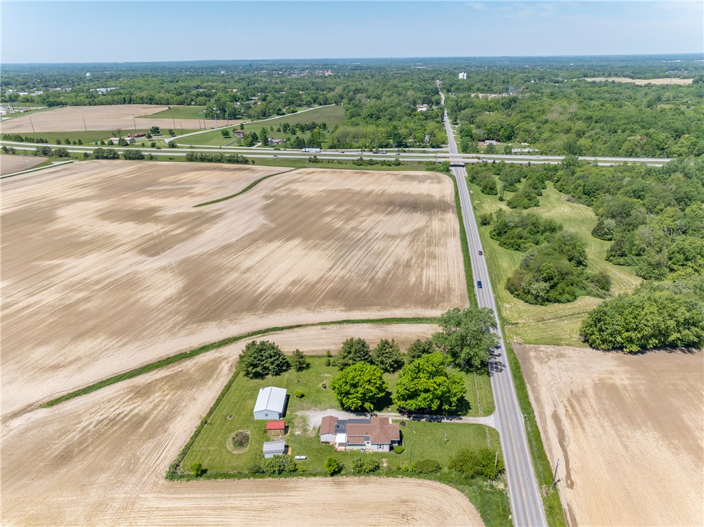 1217 Jasper Road Xenia, OH 45385 - Photo 60 of 62 An aerial perspective reveals a home surrounded by lush fields and expansive green spaces.