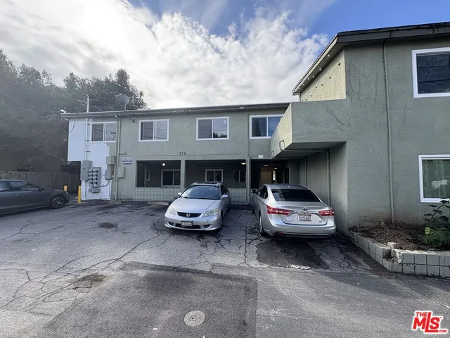 a car parked in front of a house