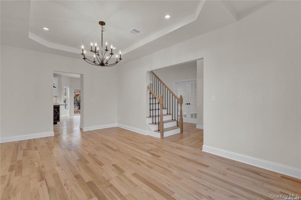 Lot 3 Westfield Road Coram, NY 11727 - Photo 3 of 25 a view of an empty room with wooden floor