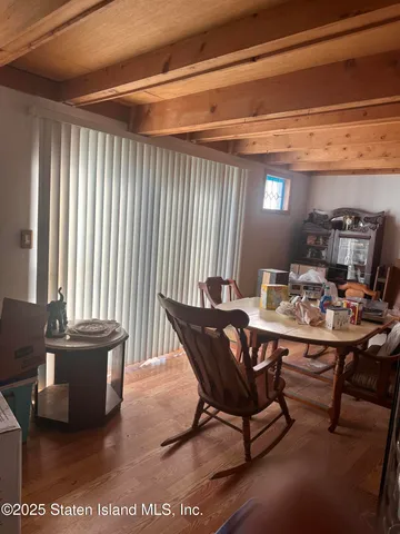 a view of a dining room with furniture and window
