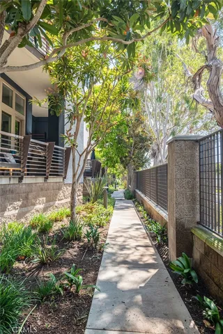 a view of a pathway of a house with a yard