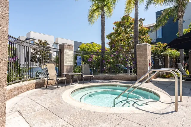 a swimming pool with outdoor seating and yard