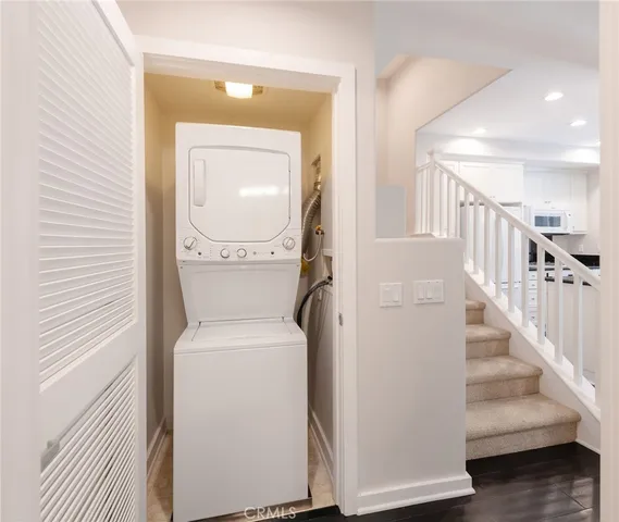 a view of hallway with washer and dryer