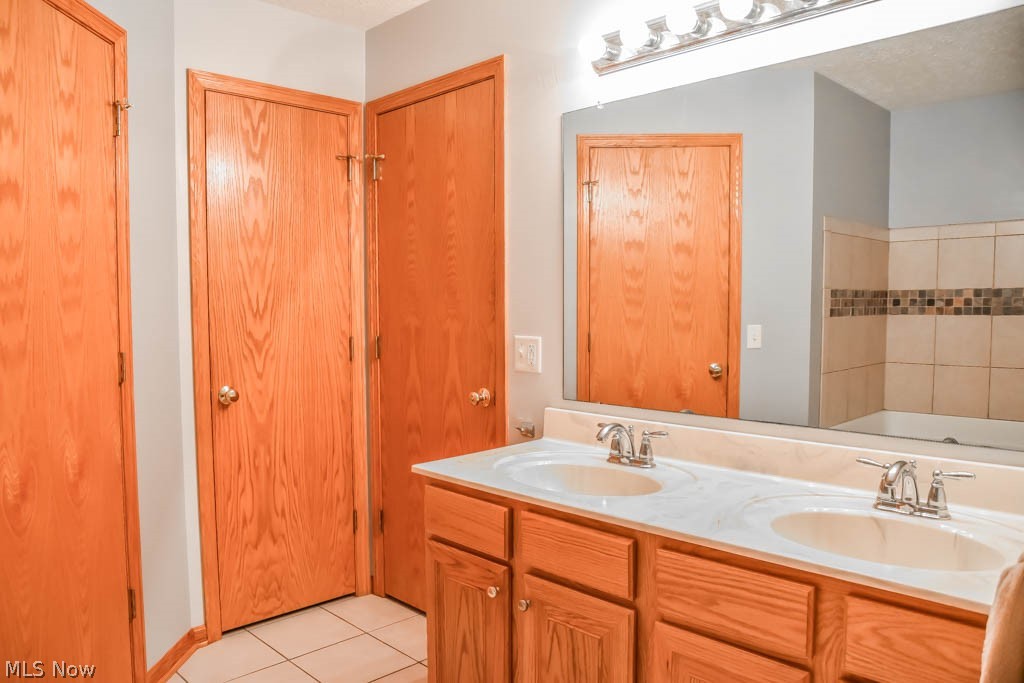 7004 Sweetwater Road Northeast Canton, OH 44721 - Photo 13 of 35 Private master bath with dual sinks.
