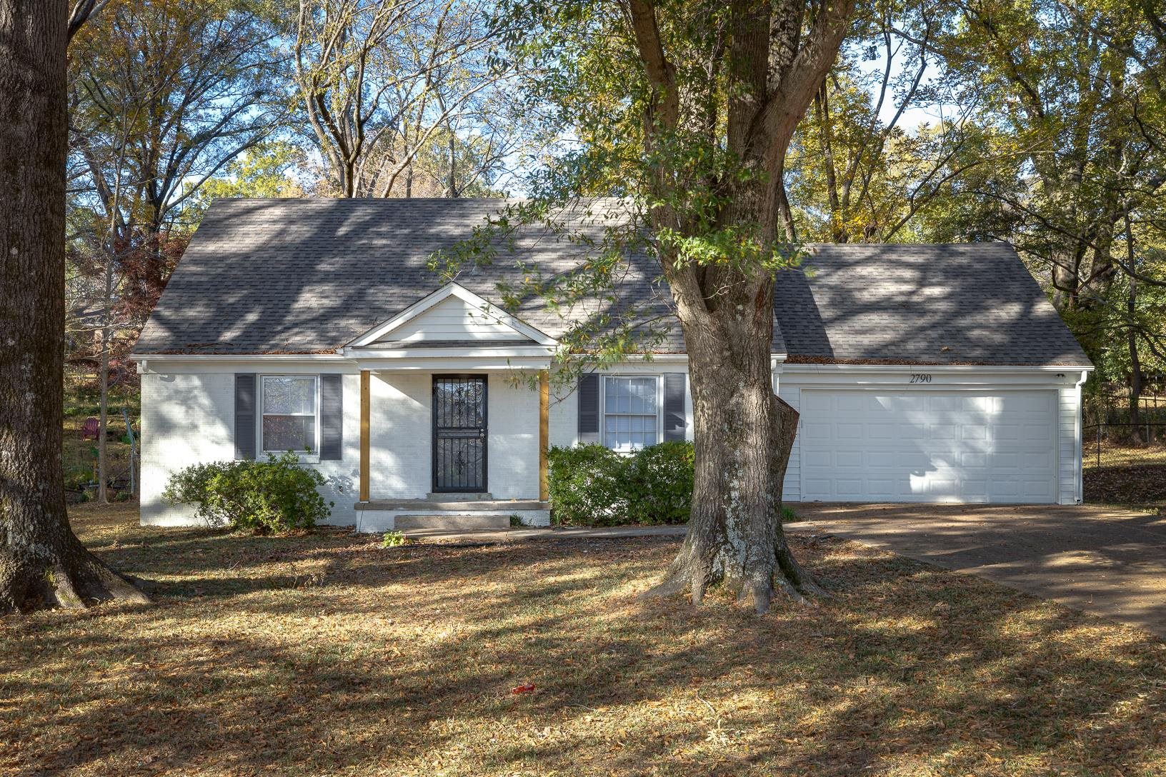2790 James Road Memphis, TN 38127 - Photo 1 of 19 a front view of a house with a yard and potted plants