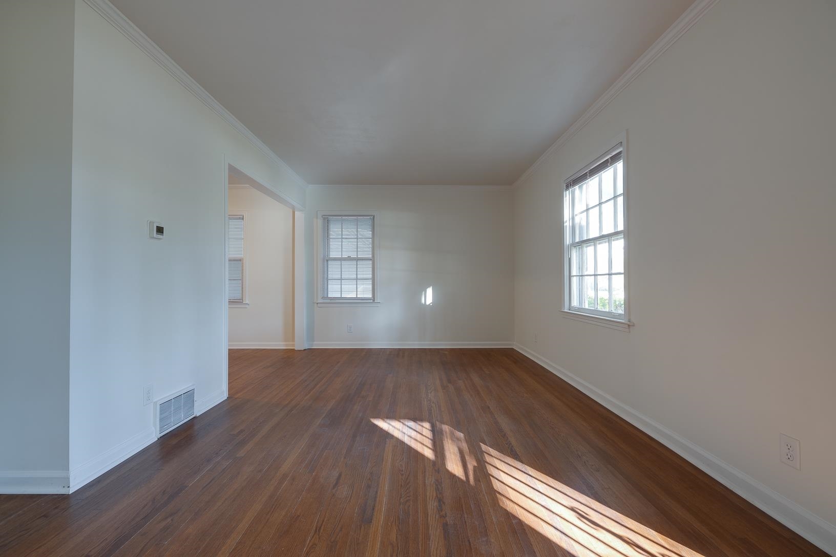2790 James Road Memphis, TN 38127 - Photo 3 of 19 an empty room with wooden floor and windows