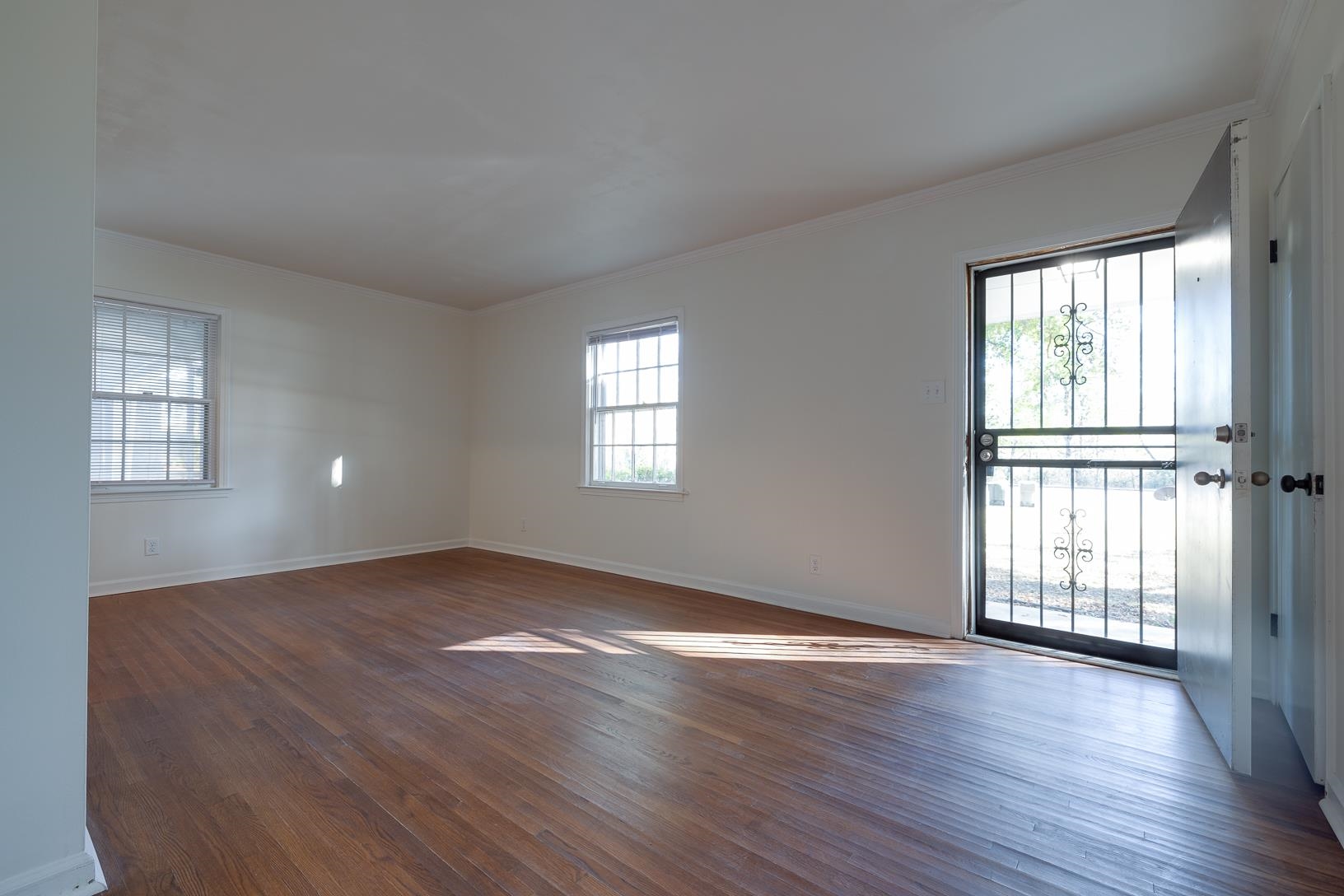 2790 James Road Memphis, TN 38127 - Photo 4 of 19 an empty room with wooden floor and windows