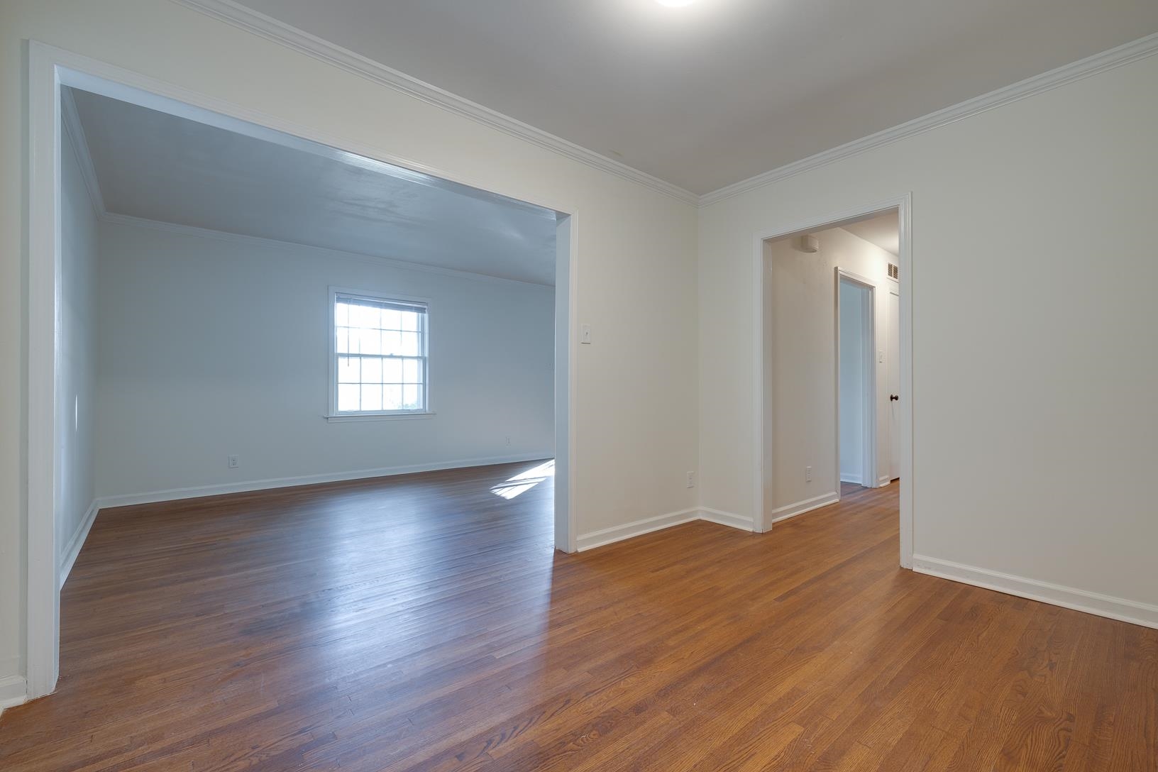 2790 James Road Memphis, TN 38127 - Photo 5 of 19 a view of an empty room with wooden floor and a window