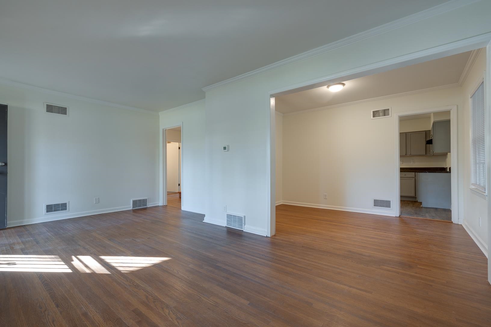 2790 James Road Memphis, TN 38127 - Photo 6 of 19 a view of an empty room with wooden floor and a window