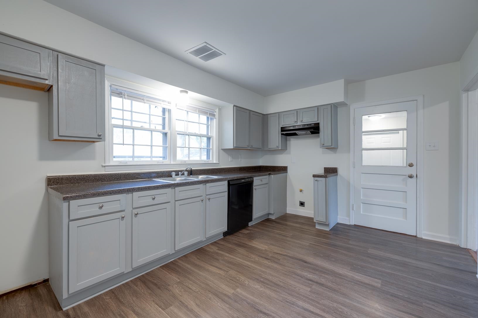 2790 James Road Memphis, TN 38127 - Photo 8 of 19 a kitchen with granite countertop white cabinets and white appliances