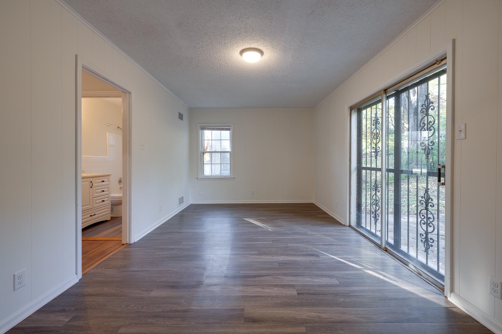 2790 James Road Memphis, TN 38127 - Photo 9 of 19 wooden floor in an empty room with a window