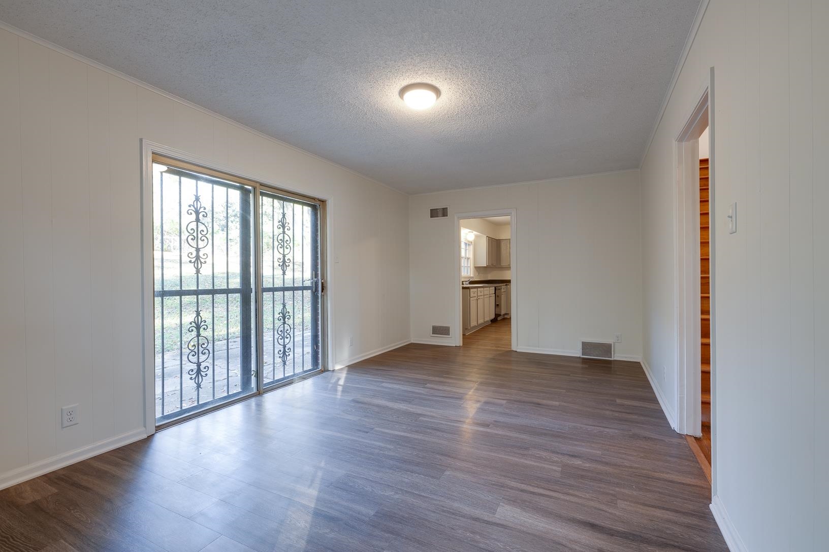 2790 James Road Memphis, TN 38127 - Photo 10 of 19 an empty room with wooden floor and windows