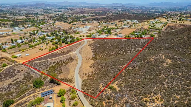 a view of a large mountain with mountains in the background