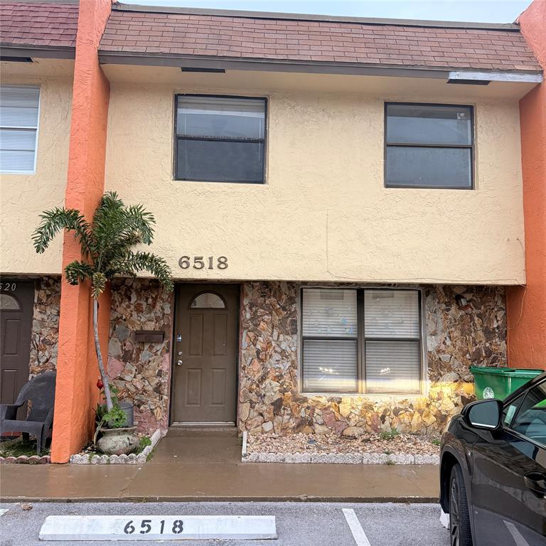 6518 Southwest 41st Street Davie, FL 33314 - Photo 1 of 9 a front view of a house with garden