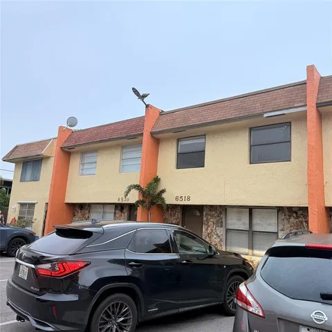 a front view of a house with parking space