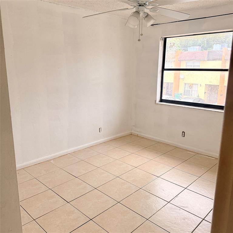 6518 Southwest 41st Street Davie, FL 33314 - Photo 6 of 9 a view of a room that has a window and a refrigerator