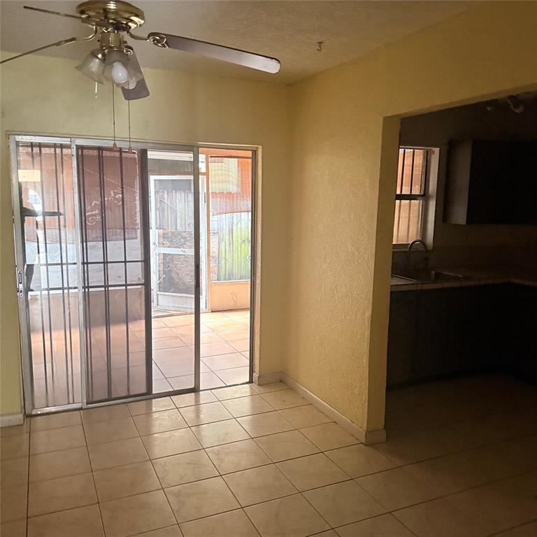 6518 Southwest 41st Street Davie, FL 33314 - Photo 7 of 9 a view of an empty room with a window