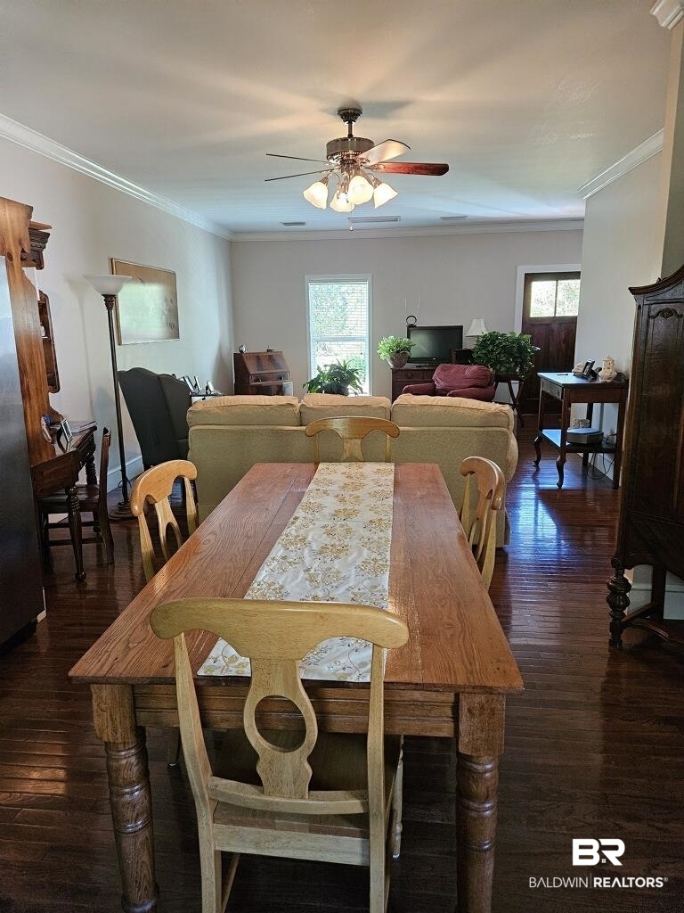 45820 Phillipsville Road Bay Minette, AL 36507 - Photo 7 of 15 Dining space featuring dark hardwood / wood-style floors, plenty of natural light, ornamental molding, and ceiling fan