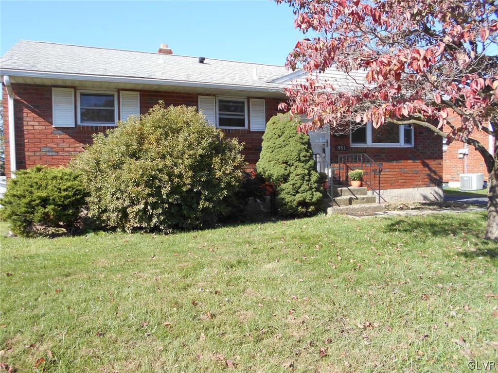 851 Elm Road Hellertown, PA 18055 - Photo 1 of 17 a front view of a house with garden