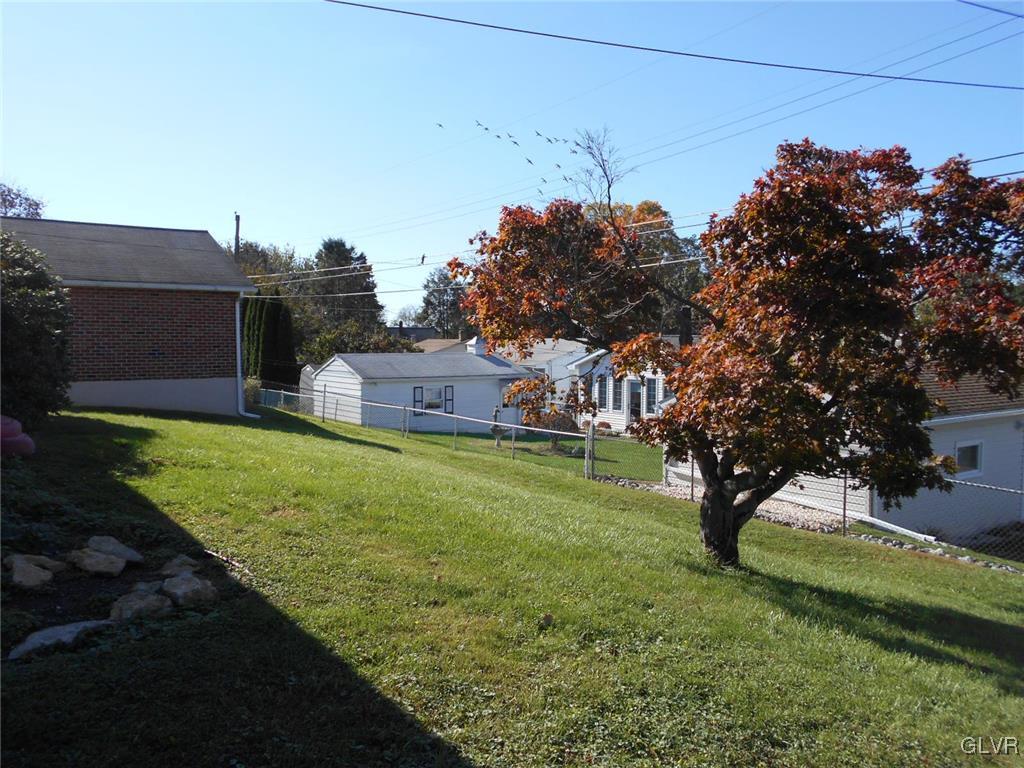 851 Elm Road Hellertown, PA 18055 - Photo 16 of 17 a backyard of a house with lots of green space