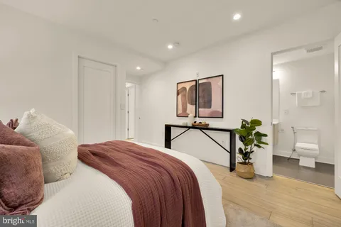 a bedroom with a balcony a bed and a couch