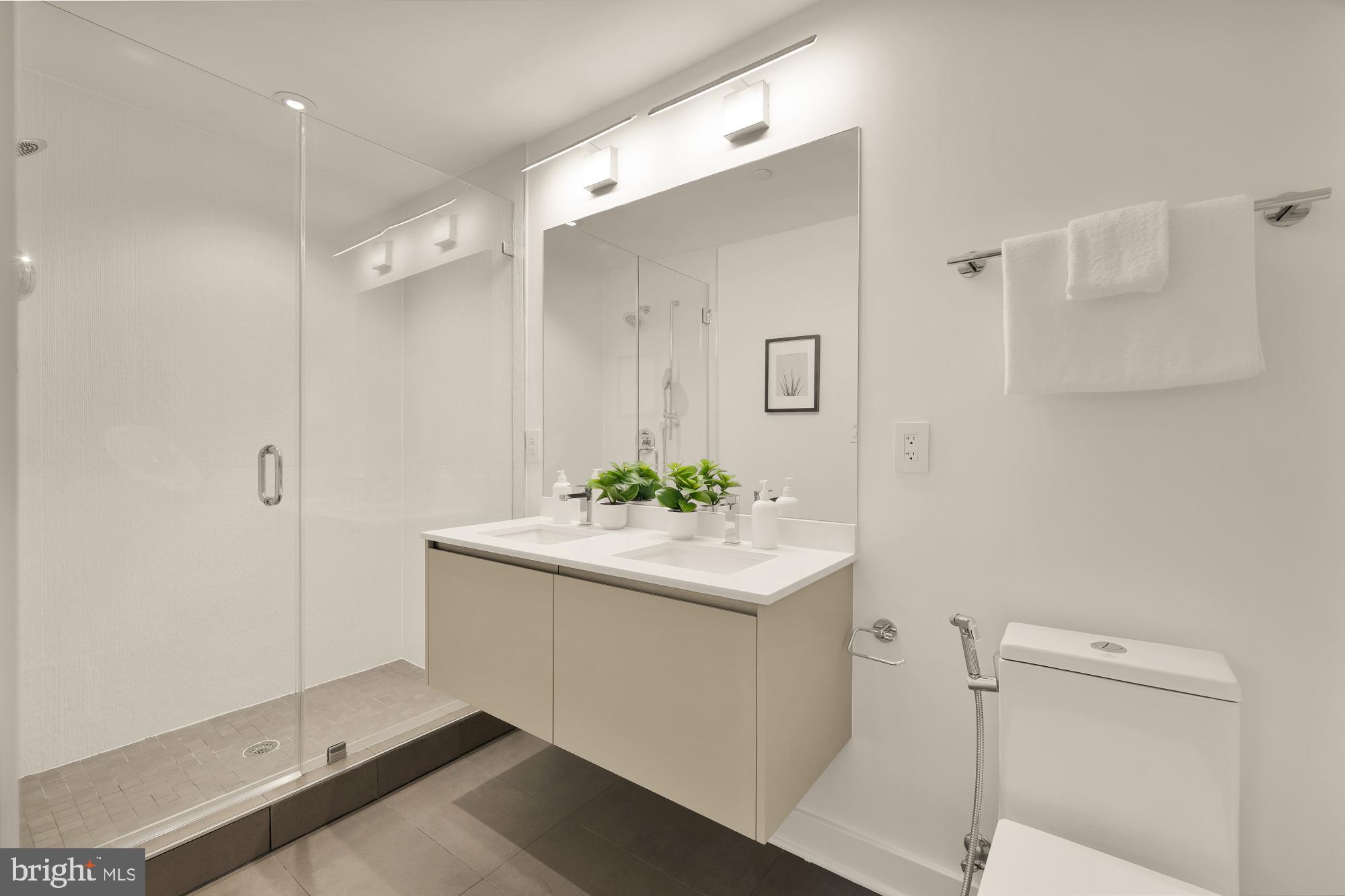 1101 Q Street Northwest, Unit 103 Washington, DC 20001 - Photo 16 of 26 a bathroom with a sink and mirror