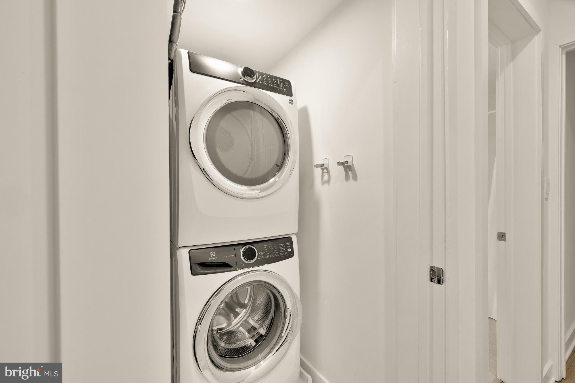 1101 Q Street Northwest, Unit 103 Washington, DC 20001 - Photo 25 of 26 a utility room with dryer and washer