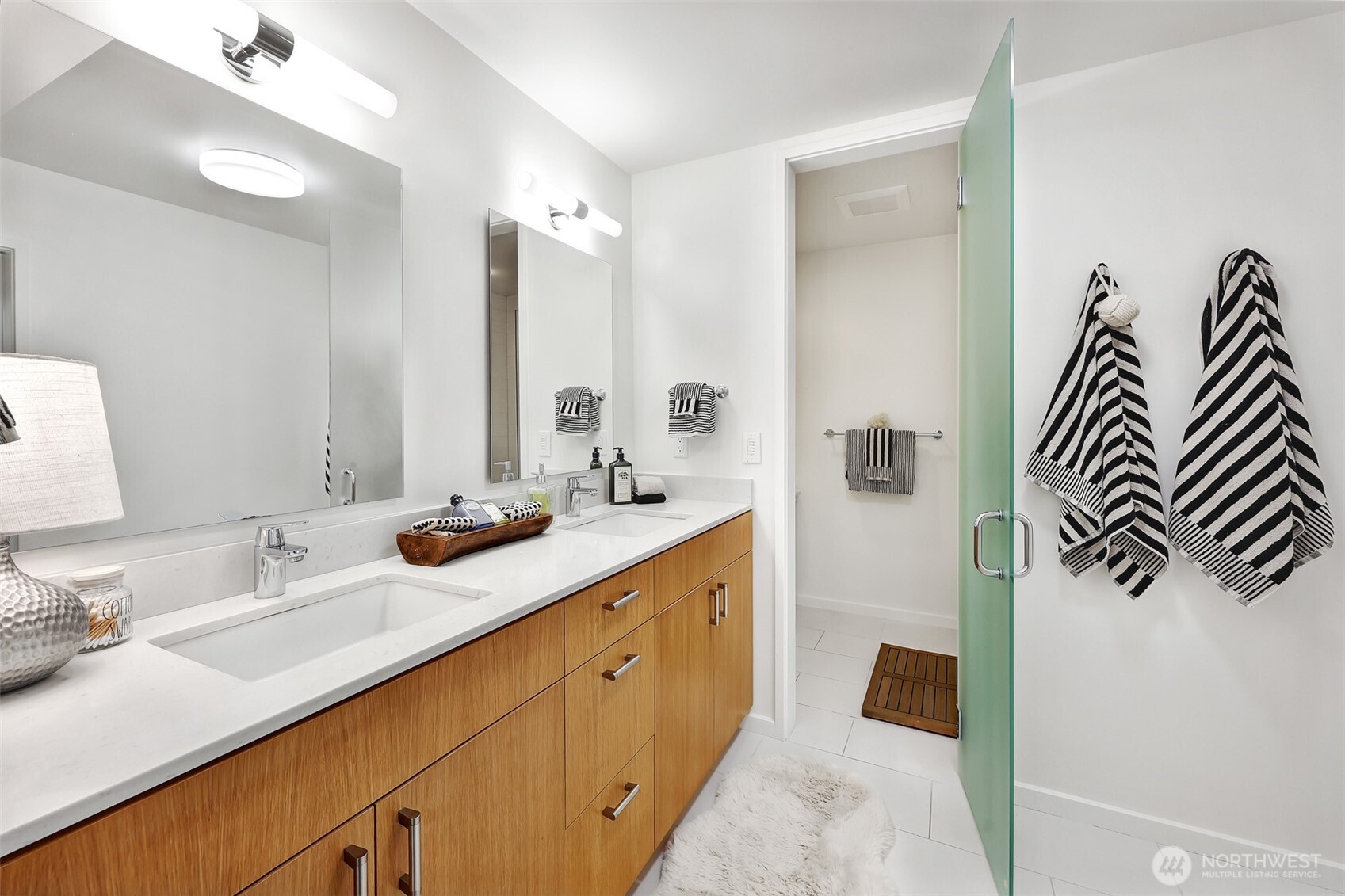 2547 Northeast 83rd Street Seattle, WA 98115 - Photo 27 of 38 a spacious bathroom with a double vanity sink mirror and