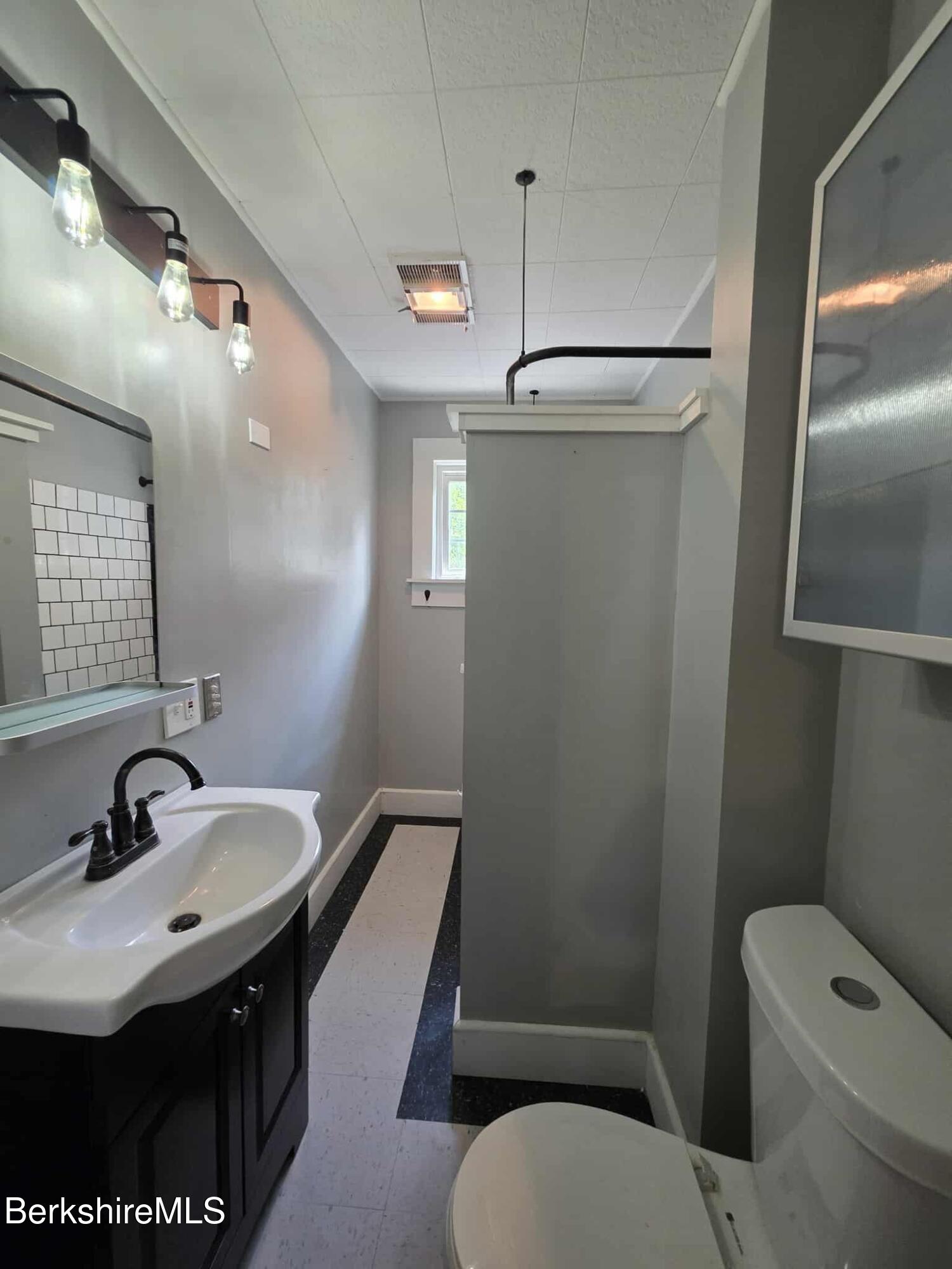 75 North Summer Street, Unit 2 Adams, MA 01220 - Photo 11 of 15 a bathroom with a sink toilet and shower