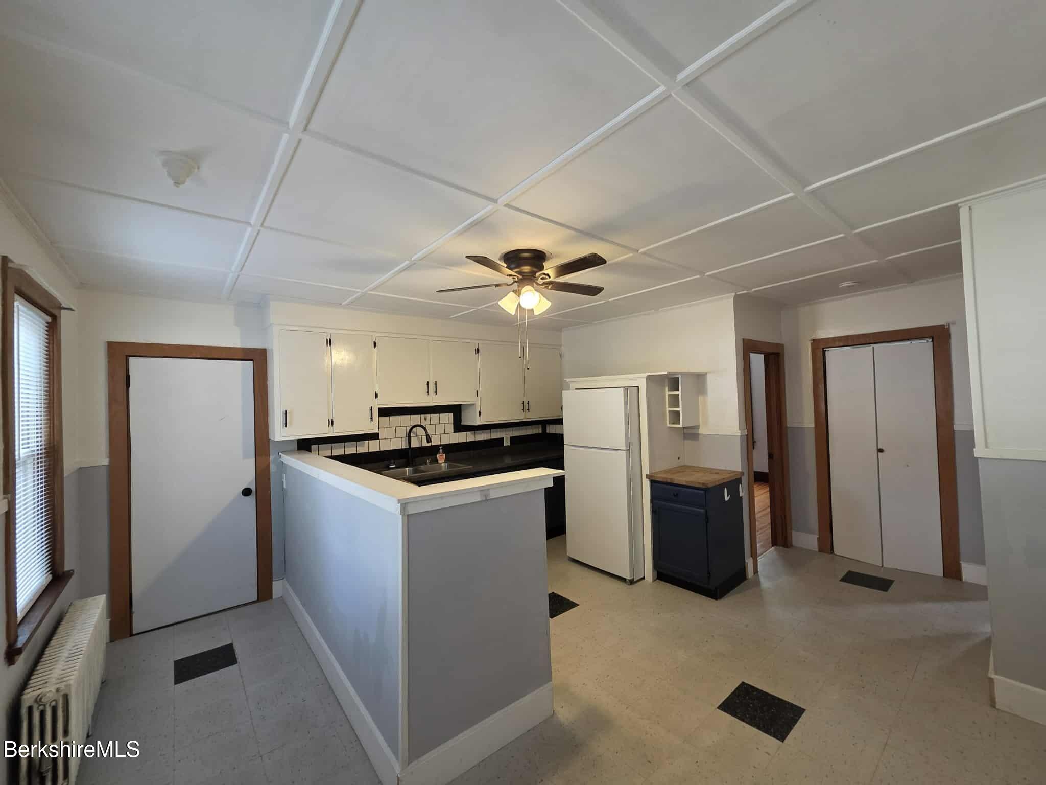 75 North Summer Street, Unit 2 Adams, MA 01220 - Photo 2 of 15 a kitchen with refrigerator and stove