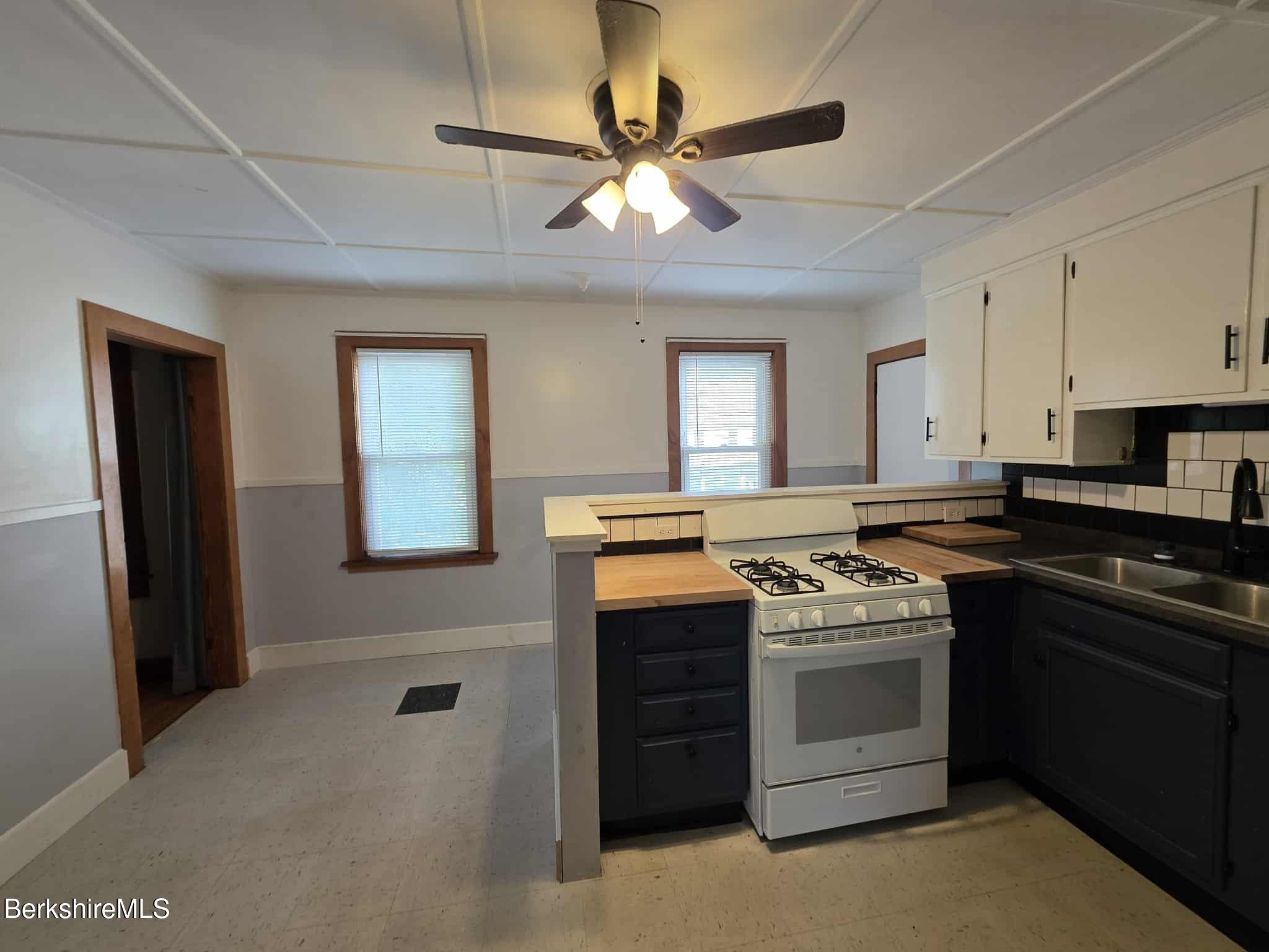 75 North Summer Street, Unit 2 Adams, MA 01220 - Photo 4 of 15 a kitchen with a stove sink and refrigerator