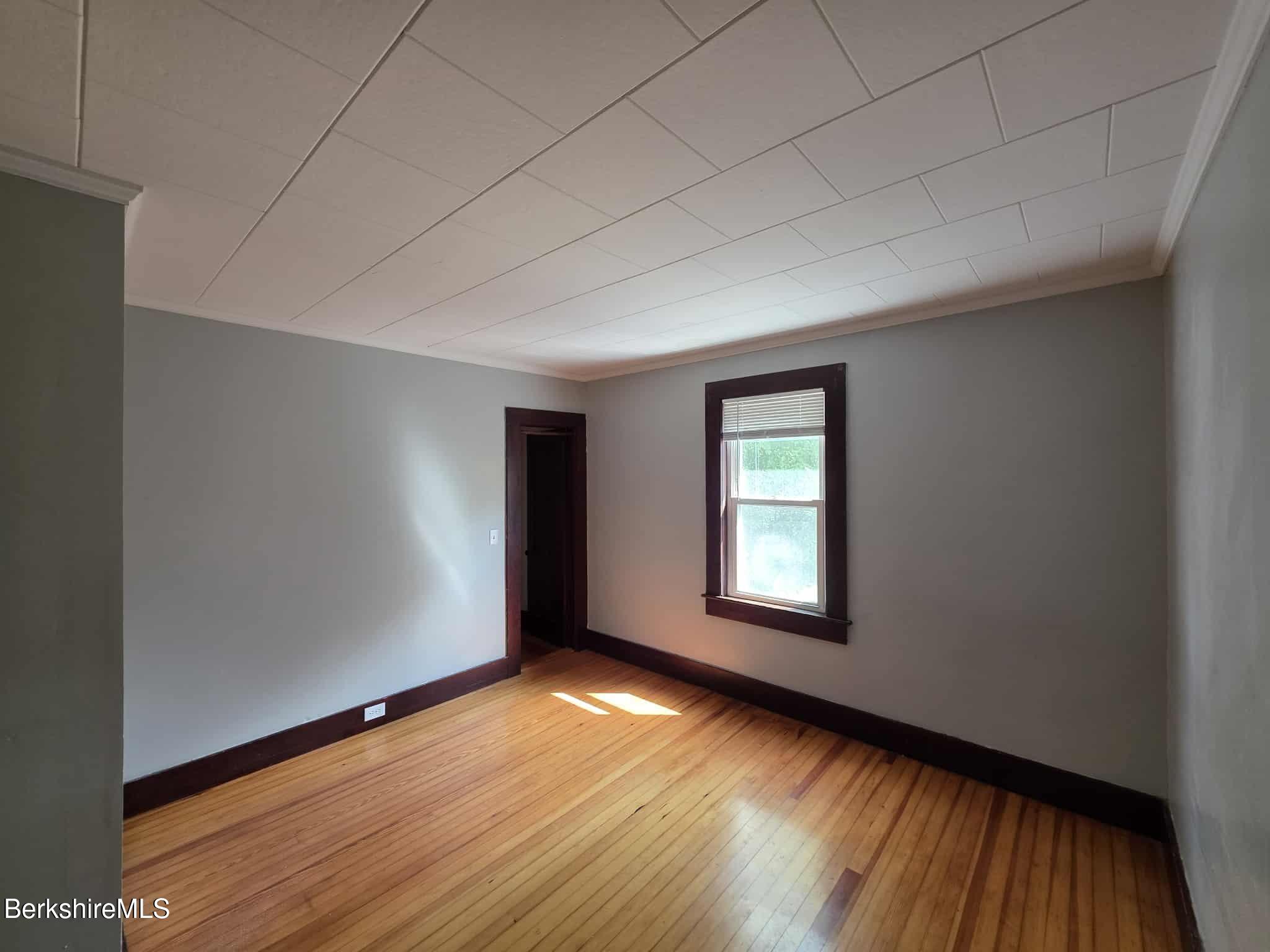 75 North Summer Street, Unit 2 Adams, MA 01220 - Photo 9 of 15 a view of empty room with window and wooden floor