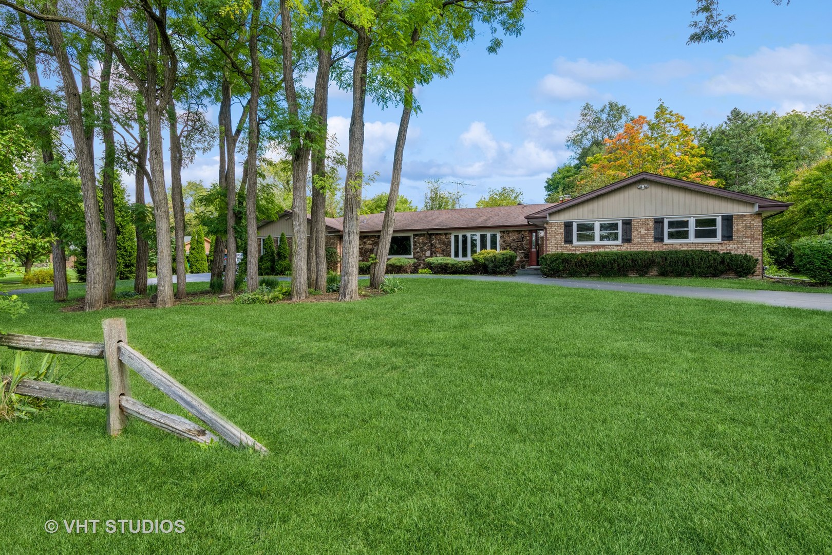 2339 Old Hicks Road Long Grove, IL 60047 - Photo 2 of 27 a view of a house with a big yard and large trees