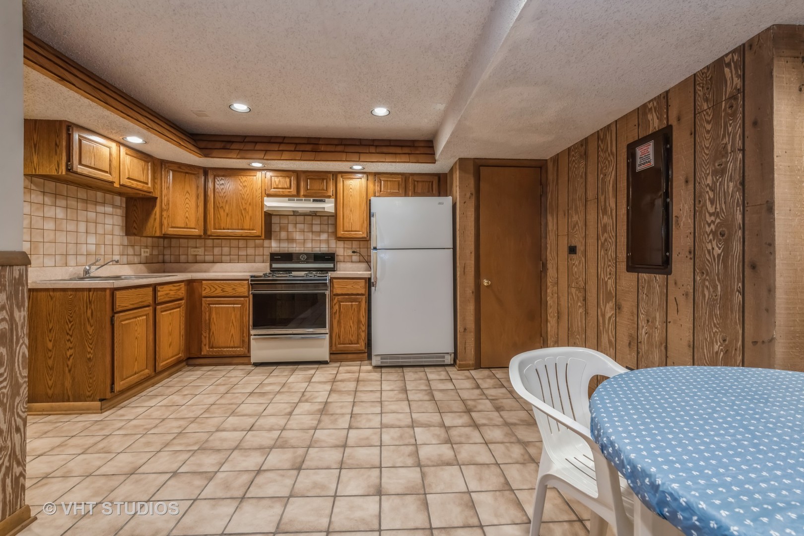 2339 Old Hicks Road Long Grove, IL 60047 - Photo 22 of 27 a kitchen with a sink a counter top space cabinets and stainless steel appliances