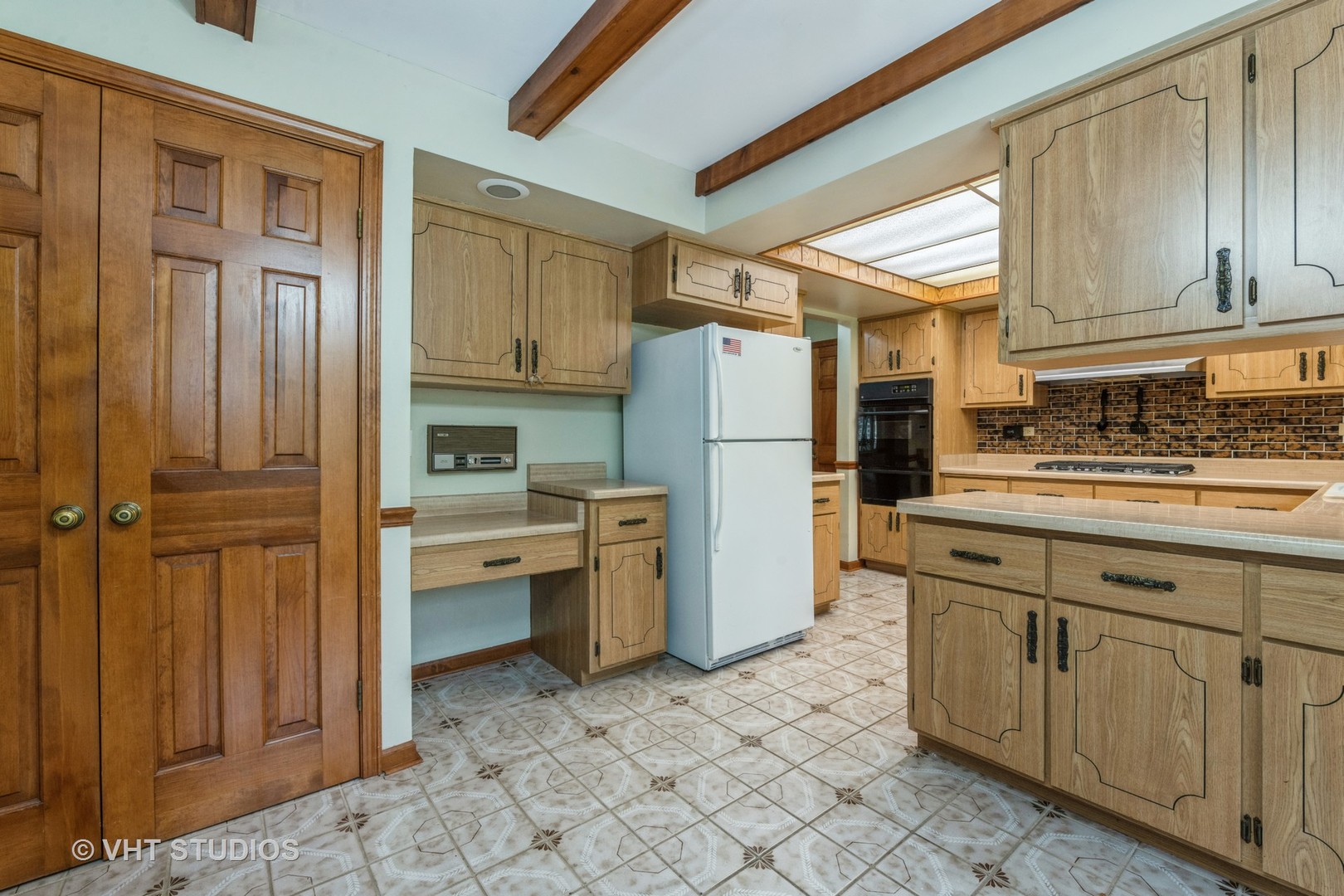 2339 Old Hicks Road Long Grove, IL 60047 - Photo 9 of 27 a kitchen with a refrigerator and cabinets