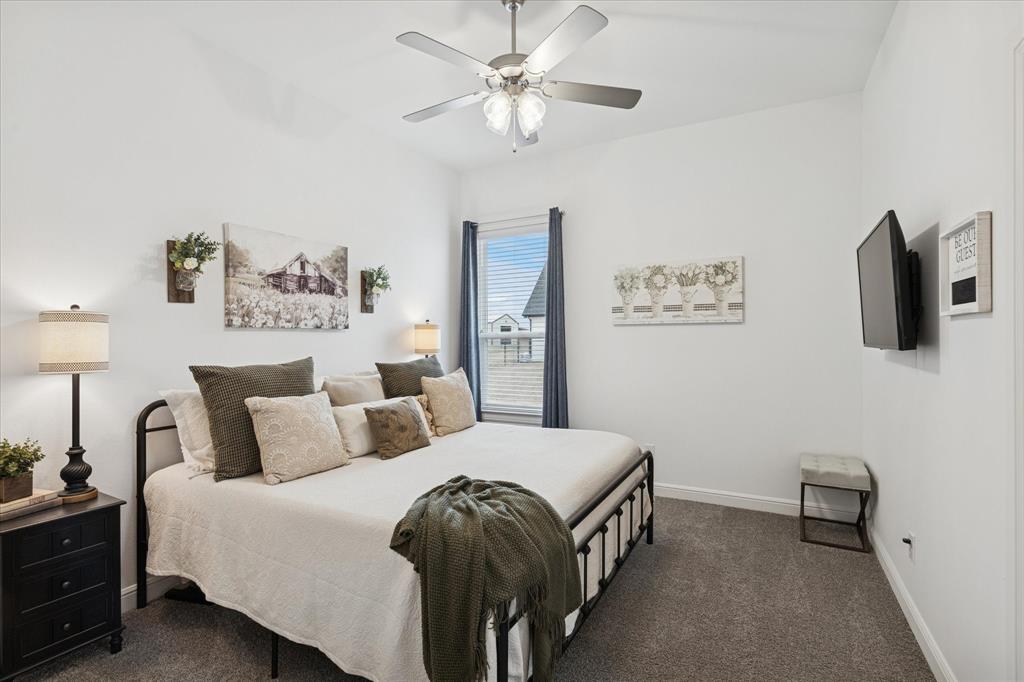 112 Friendship Way Boyd, TX 76023 - Photo 21 of 29 Carpeted bedroom featuring a ceiling fan with integrated lighting, a window with blinds, and white walls