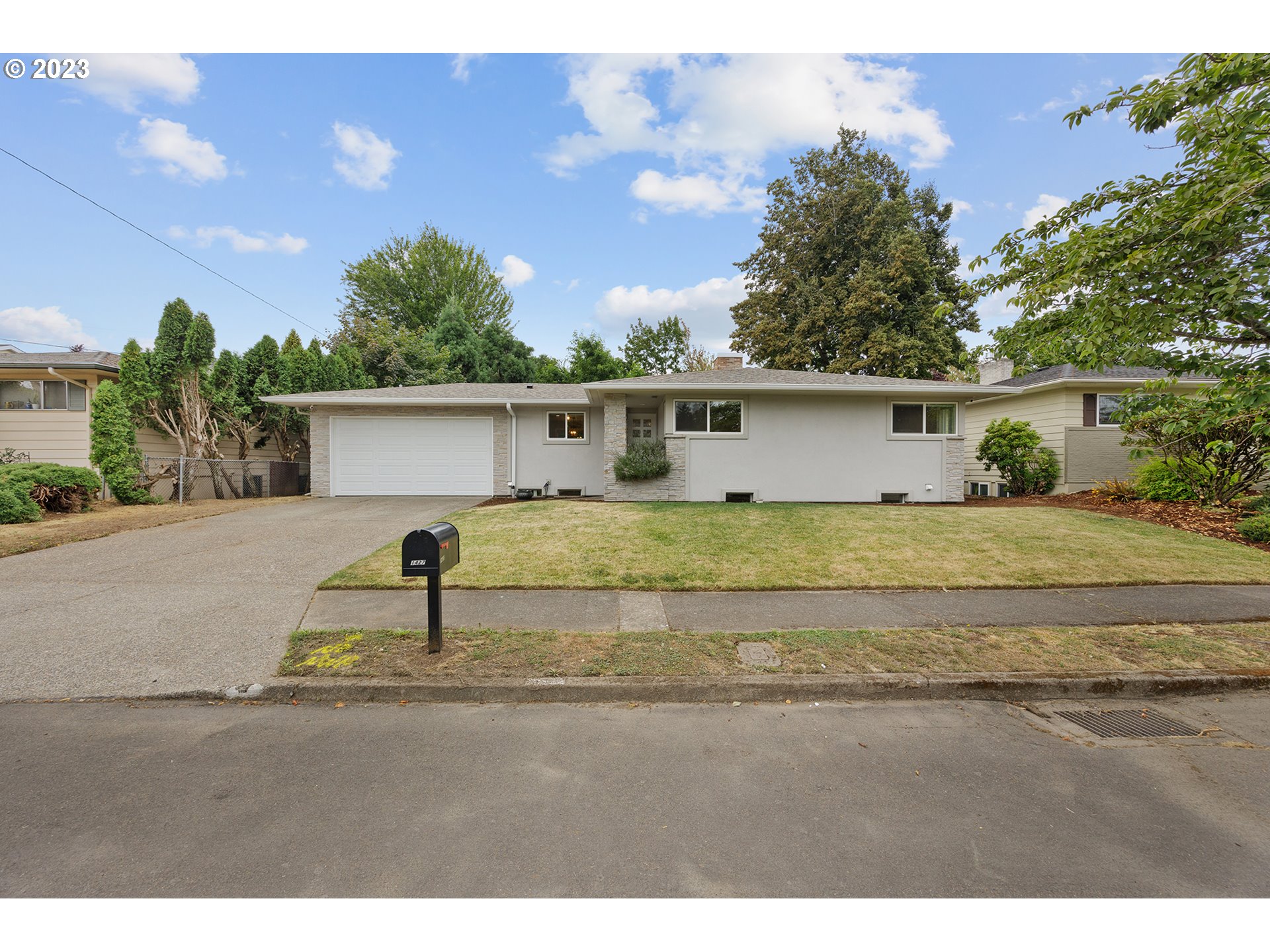 1427 Southeast 109th Avenue Portland, OR 97216 - Photo 1 of 44 a house view with a backyard space
