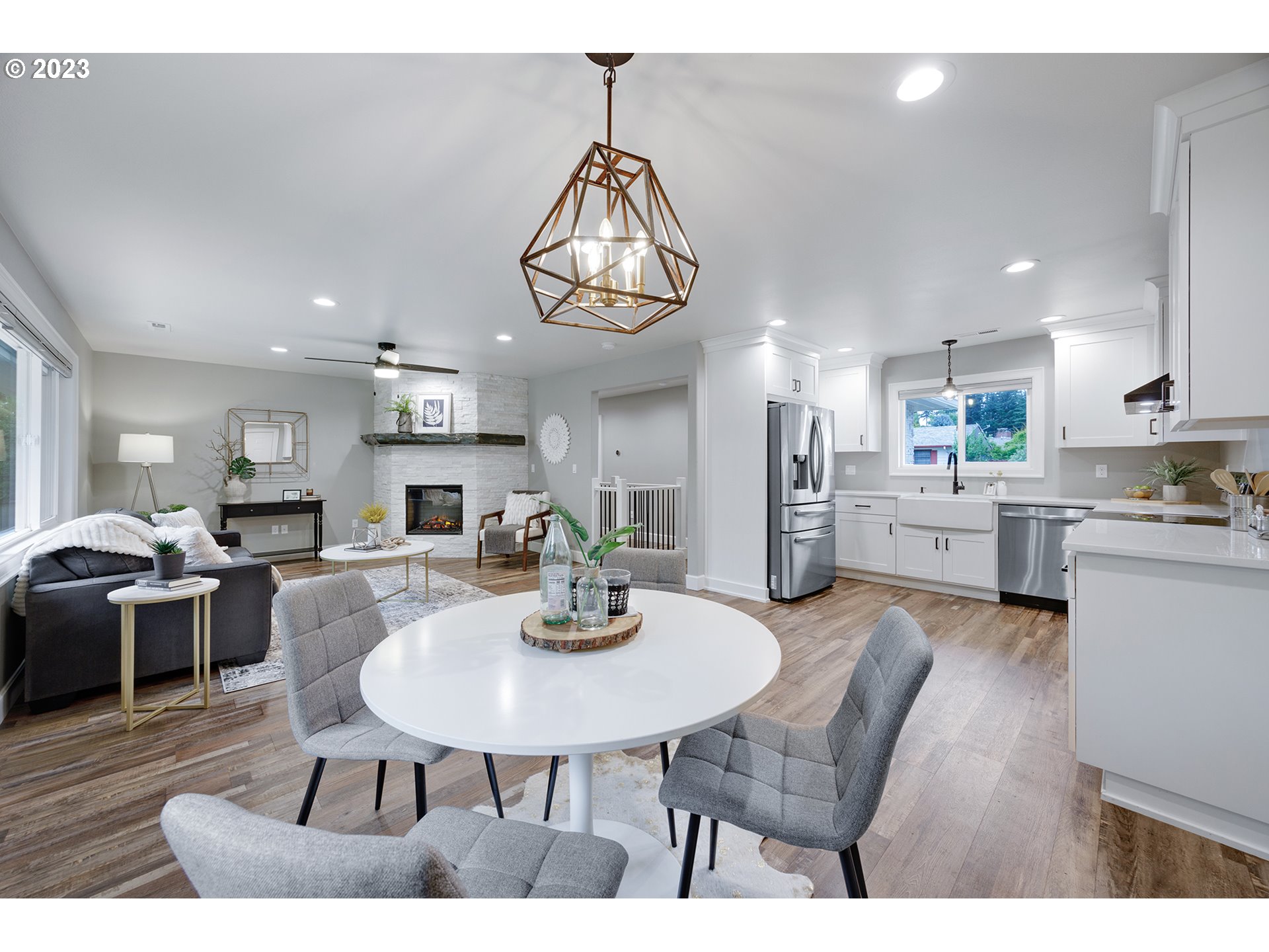 1427 Southeast 109th Avenue Portland, OR 97216 - Photo 14 of 44 a kitchen with a dining table chairs and view kitchen