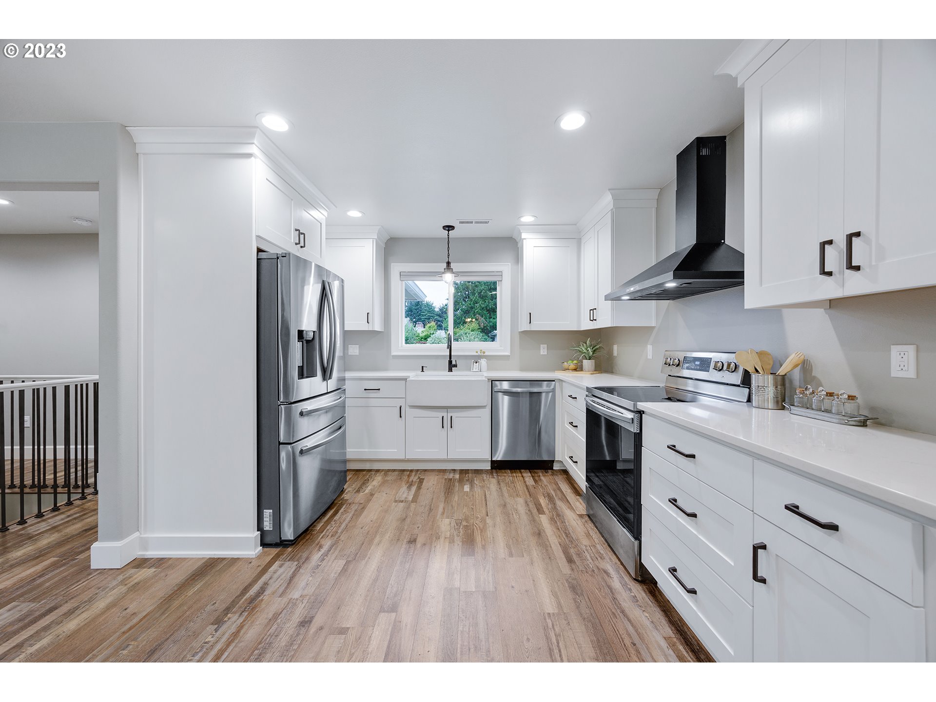 1427 Southeast 109th Avenue Portland, OR 97216 - Photo 16 of 44 a kitchen with white cabinets and stainless steel appliances