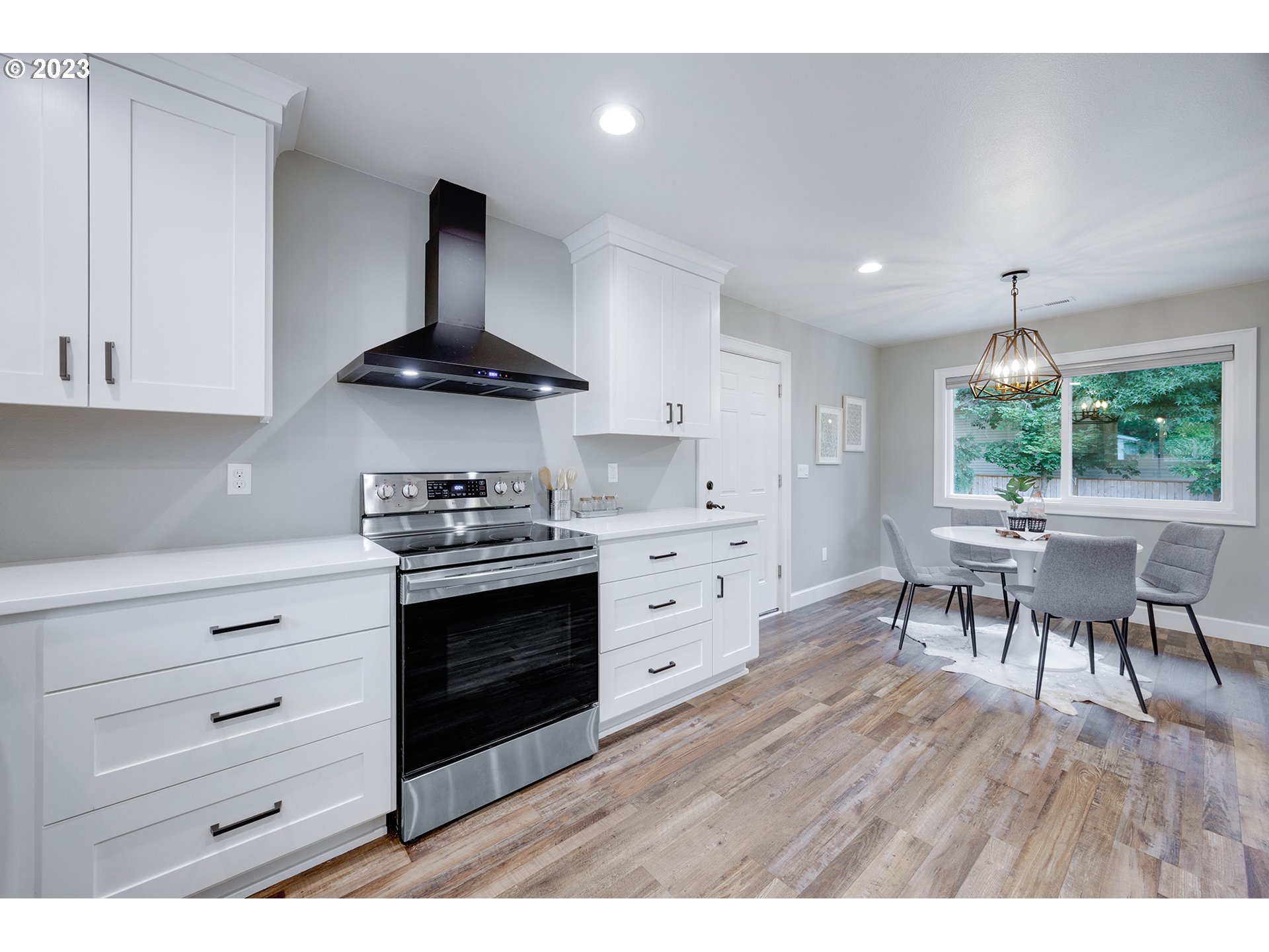 1427 Southeast 109th Avenue Portland, OR 97216 - Photo 17 of 44 a kitchen with stainless steel appliances granite countertop a stove and a refrigerator